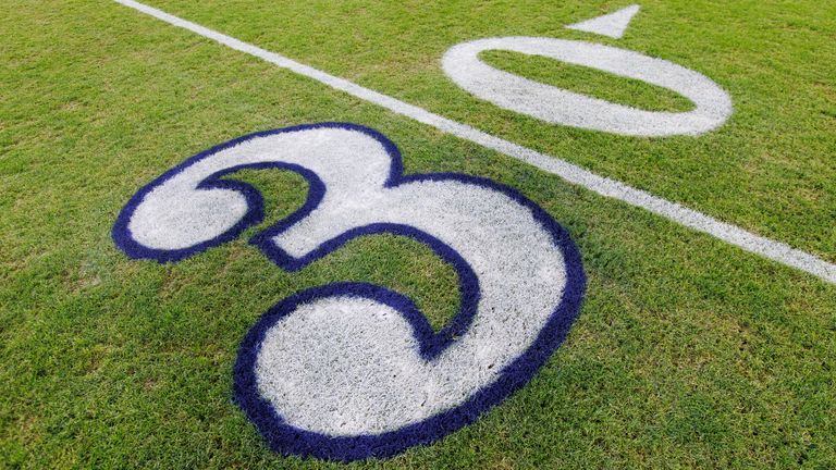 Jan 8, 2023; Green Bay, Wisconsin, USA; General view of the outlined number three on the field honoring Buffalo Bills player Damar Hamlin prior to the game between the Detroit Lions and Green Bay Packers at Lambeau Field. Mandatory Credit: Jeff Hanisch-USA TODAY Sports