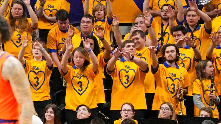 Members of the Pitt Band wear wear t-shirts in a salute to former University of Pittsburgh football player Damar Hamlin, during the first half of an NCAA college basketball game between Pittsburgh and Clemson in Pittsburgh, Saturday, Jan. 7, 2023. (AP Photo/Gene J. Puskar)