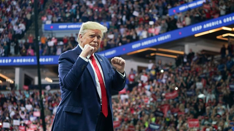 President Donald Trump greeted cheering crowds at the Target Center in Minneapolis, Minnesota