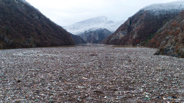 Parts of the rubbish-filled river are surrounded by breath-taking scenery