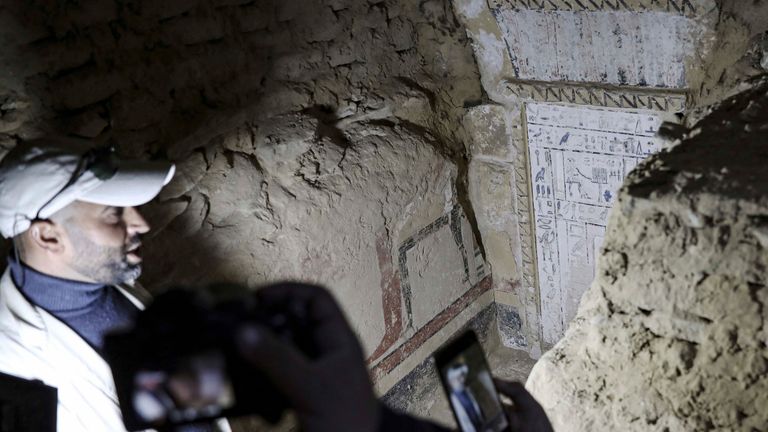 An Egyptian archaeologist speaks in front of a recently discovered tomb Pic;:AP