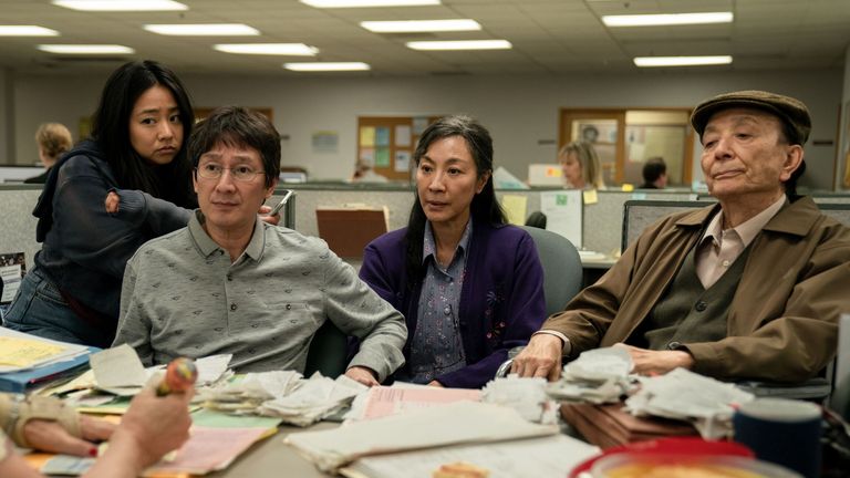 Stephanie Hsu, Ke Huy Quan, Michelle Yeoh and James Hong in Everything everywhere at once.  photo: A24