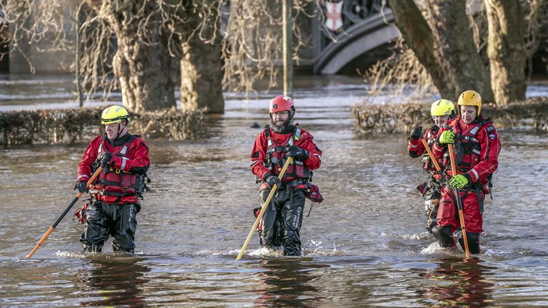 Rescue workers wade through floodwater in the centre of York after the River Ouse burst its banks. Picture date: Saturday January 14, 2023.