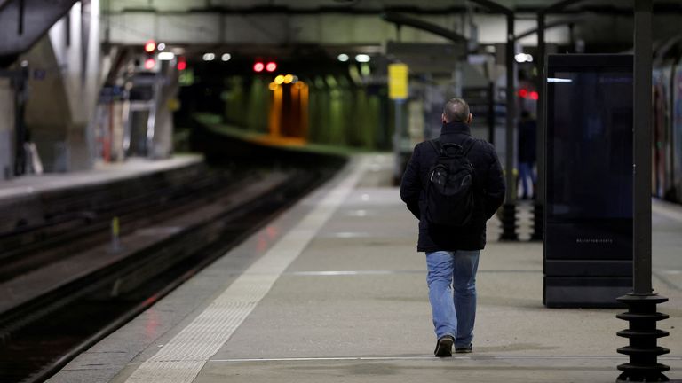 A man walks on an empty platform at Gare Montparnasse 