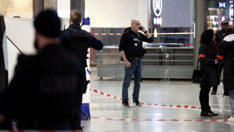 Police secure the area after a man with a knife wounded several people at the Gare du Nord train station in Paris 