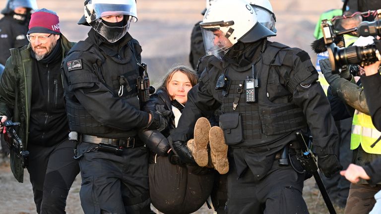 Swedish environmental activist Greta Thunberg is taken away by police Pic:AP