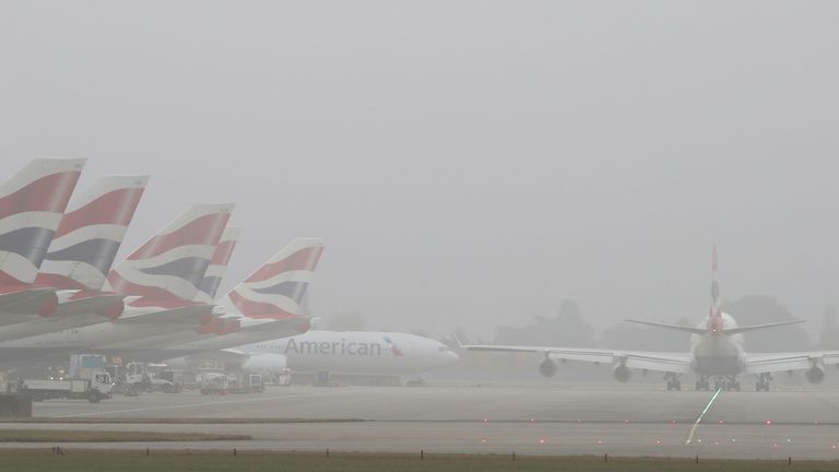 File Pic: Planes in the fog at Heathrow Airport, London.