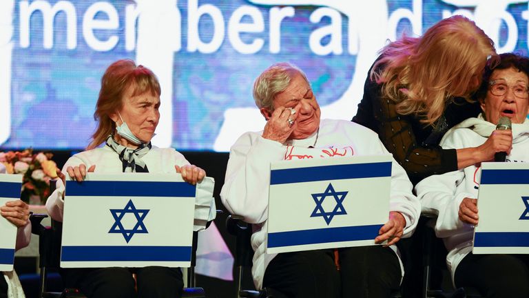 Holocaust Survivor Fany Zelikovitz, 92, who was born in Poland reacts as she takes part in the performance of the original song "I have survived" by a choir of Holocaust Survivors at a ceremony hosted by the Yad Ezer Lechaver Association to mark the International Day in Memory of the Victims of the Holocaust in Haifa, Israel 