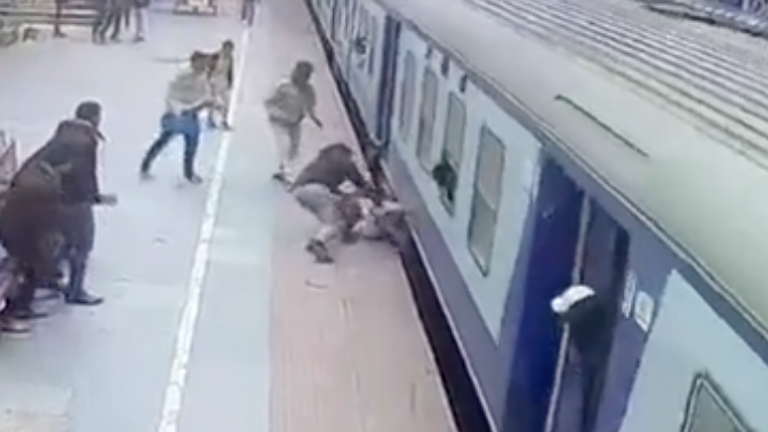 Passenger Narrowly Avoids Being Pulled Under Train at Indian Station