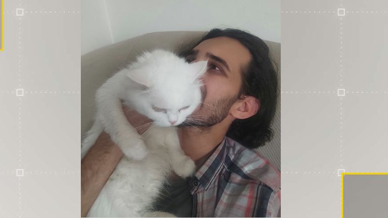 Mohammed Hassan and his cat Pashmak.  Photo: Twitter