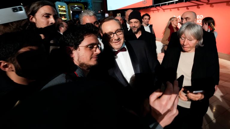 Fans take selfies with actor Kevin Spacey at the National Museum of Cinema in Turin, Monday, Jan. 16, 2023. Kevin Spacey was in the northern Italian city of Turin on Monday to receive the lifetime achievement award, teach a master class and introduce a screening of the 1999 film "American Beauty." (AP Photo/Luca Bruno)