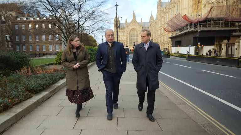 Sebastien Lai with his lawyers, Ms Gallagher and Jonathan Price, outside parliament