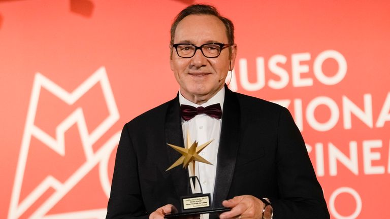 Actor Kevin Spacey poses with an award at the National Museum of Cinema in Turin, Monday, Jan. 16, 2023. Kevin Spacey was in the northern Italian city of Turin on Monday to receive a lifetime achievement award, teach a master class and introduce a screening of the 1999 film "American Beauty." (AP Photo/Luca Bruno)