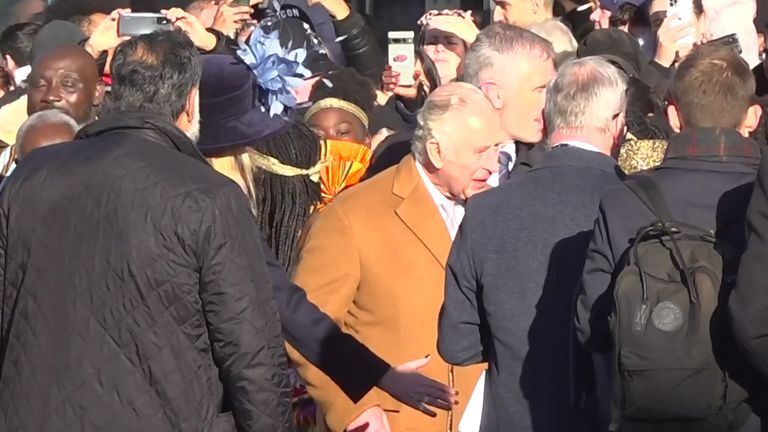 Screen grab taken from PA Video of close-protection officers ushering King Charles III away from the crowd as he was meeting members of the public during a visit to Luton. A man in his 20s has been arrested on suspicion of common assault during a walkabout by the King in Luton town centre after an egg is believed to have been thrown in the direction of the monarch. Picture date: Tuesday December 6, 2022.