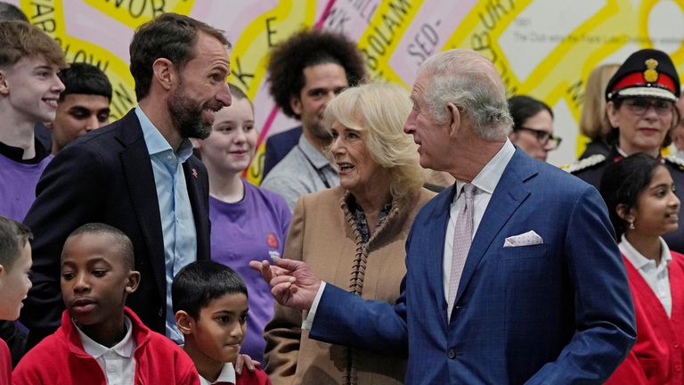 Britain&#39;s King Charles III, right, and Camilla, the Queen Consort, center, talk to Gareth Southgate, England football manager and Prince&#39;s Trust ambassador, left, at Norbrook Community Centre, Wythenshawe, in Manchester, Britain, Friday Jan. 20, 2023