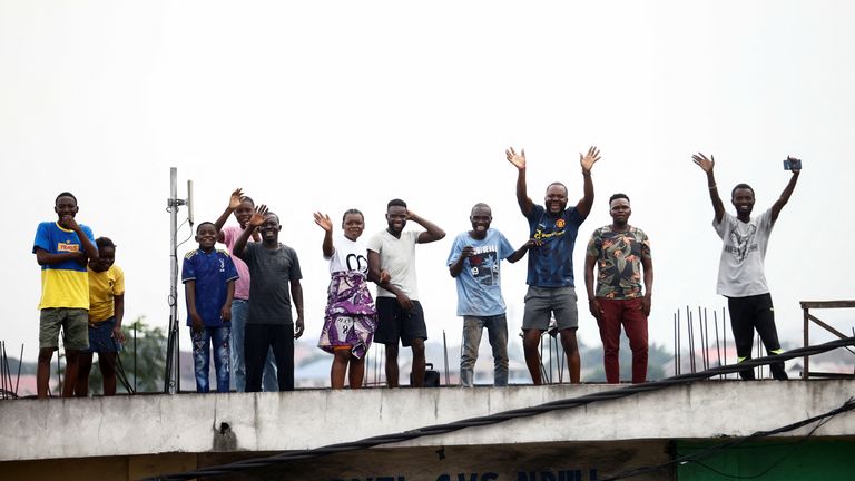 People react as Pope Francis arrives to start his apostolic journey, in Kinshasa, Democratic Republic of Congo, January 31, 2023. REUTERS/Yara Nardi
