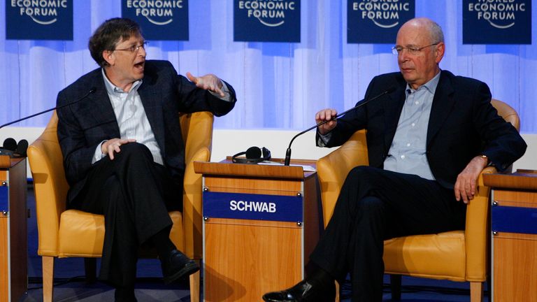 Microsoft founder Bill Gates (L) talks to Klaus Schwab, the founder of the World Economic Forum (WEF) in Davos in 2008