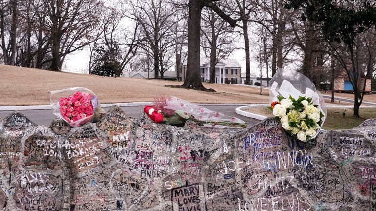 Flowers were seen as music fans paid tribute in memory of singer Lisa Marie Presley, who was "Rolls Royce, King of Rock and Roll," Elvis Presley, outside Graceland, in her birthplace of Memphis, Tennessee, on January 13, 2023. REUTERS/Karen Pulfer Focht