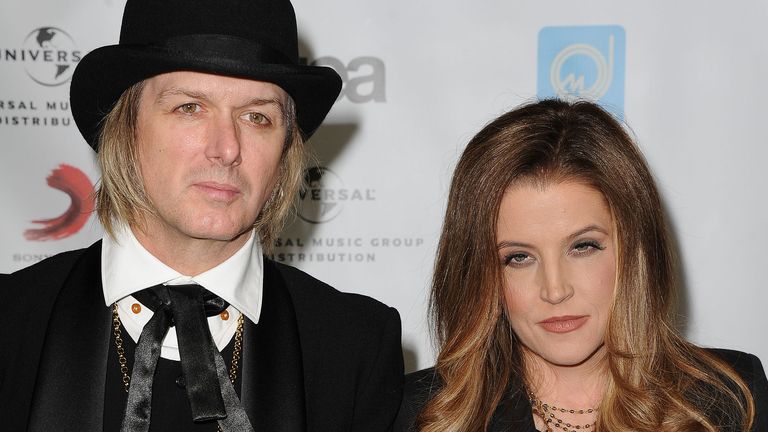 Lisa Marie Presley, at right, and her husband, Michael Lockwood arrive at NARM Music Biz 2012 Awards, Thursday, May 10, 2012, at The Hyatt Regency in Century City, Calif. NARM (National Association of Recording Merchandisers) is the trade association for the business of music, spearheading the implementation of initiatives to promote music commerce, and advocating for common interests. (AP Photo/Katy Winn)