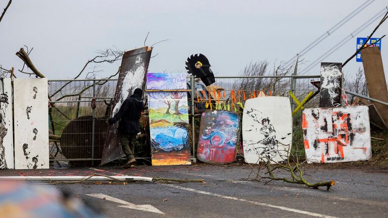 Environmental activists work on a barricade near the edge of the demolition of the Garzweiler II opencast lignite mine in Luetzerath, Germany, Thursday, Jan. 5, 2023. Police say they cleared a barricade again for reasons security in the occupied village of Luetzerath.  The village of Luetzerath is abandoned by its inhabitants but occupied by opponents of lignite mining to protest against the continued expansion of fossil fuels.  (Rolf Vennenberg/dpa via AP).  Photo: AP