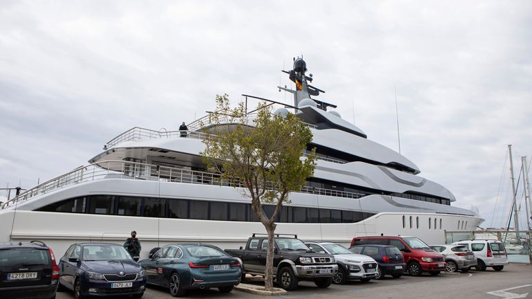 A vigilante stands by the yacht named Tango in Palma de Mallorca, Spain Monday, April 4, 2022. Pic:AP
