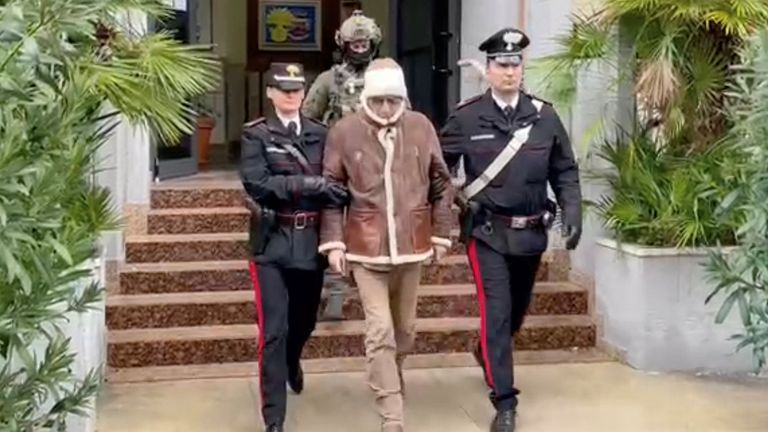 Matteo Messina Denaro the country&#39;s most wanted mafia boss being escorted out of a Carabinieri police station after he was arrested in Palermo