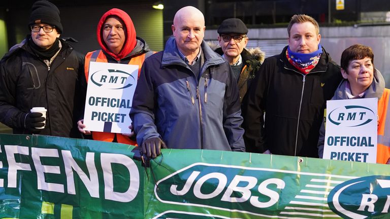 Mick Lynch (centre), general secretary of the Rail, Maritime and Transport union (RMT) joins members on the picket line outside London Euston train station, in a long-running dispute over jobs and pensions. Picture date: Tuesday January 3, 2023.