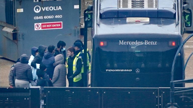 The migrants boarded a coach at the Immigration Processing Center in Kent.