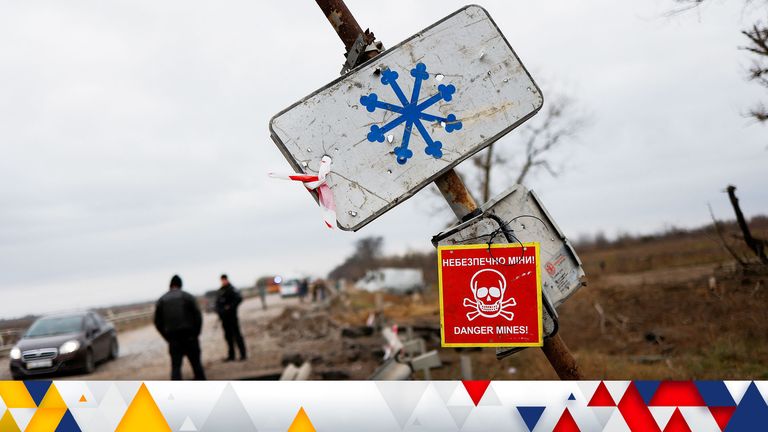 A mine danger sign is pictured on a pole by the main road to Kherson, Ukraine November 16, 2022. REUTERS/Murad Sezer
