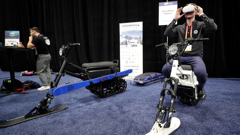 Gaston LaChaize of Moonbikes Motors uses virtual reality goggles as he sits on an electric snowbike during the CES Unveiled press event at CES 2023, an annual consumer electronics trade show, in Las Vegas, Nevada, US January 3, 2023. REUTERS/Steve Marcus