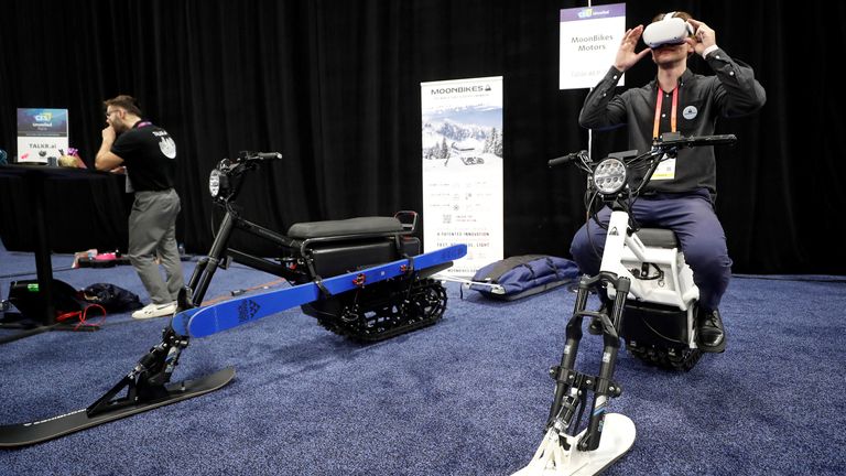 Gaston LaChaize of Moonbikes Motors uses a virtual Reality goggles. REUTERS/Steve Marcus