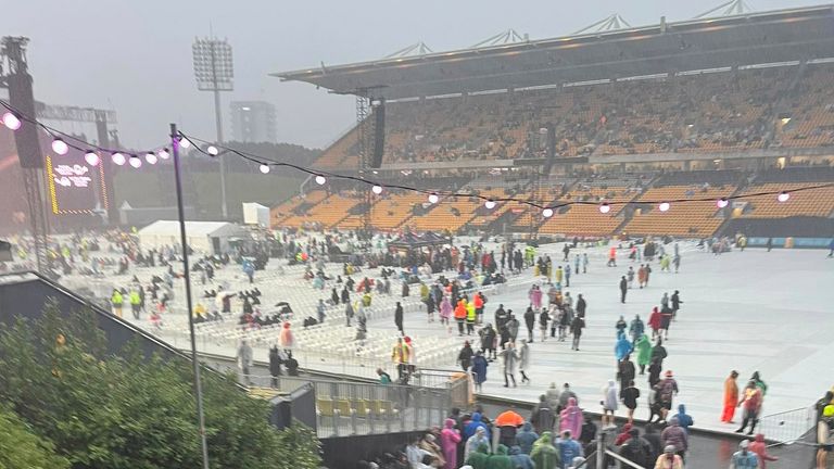 Fans leave the Mt Smart Stadium after Elton John's concert was cancelled.  (Julea Dalley/New Zealand Herald via AP)