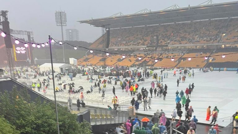 Fans leave Mt Smart Stadium after the Elton John concert was cancelled. (Julea Dalley/New Zealand Herald via AP)