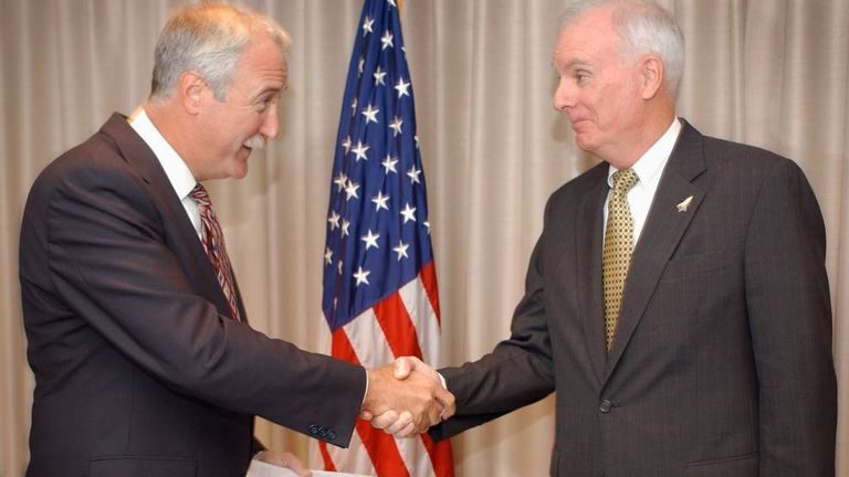 NASA Administrator Sean C. O’Keefe accepts a copy of the Columbia Accident Investigation
Board’s (CAIB) report from its chair, Admiral Harold W. Gehman