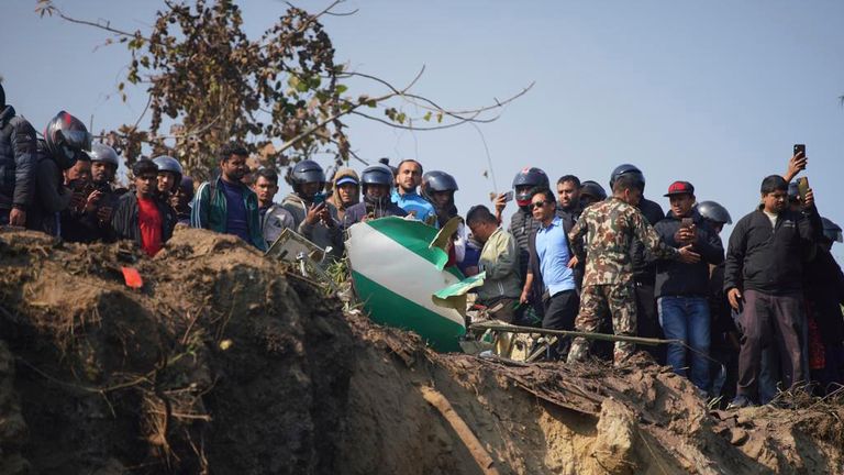 Hundreds of rescue workers scoured the hillside crash site. Pic: AP