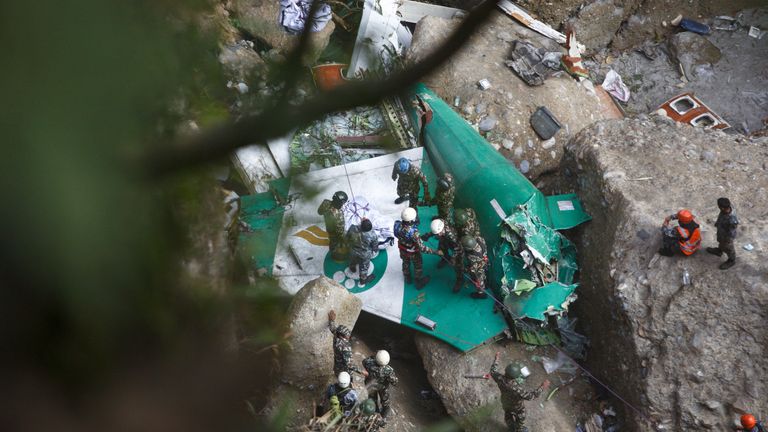 A rescue team recovers the body of a victim from the site of the plane crash of a Yeti Airlines operated aircraft, in Pokhara, Nepal January 16, 2023. REUTERS/Sulav Shrestha NO RESALES. NO ARCHIVES
