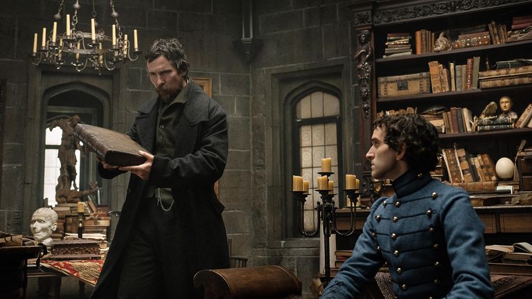 The Pale Blue Eye. (L to R) Christian Bale as Augustus Landor and Harry Melling as Edgar Allen Poe in The Pale Blue Eye.  Credit: Scott Garfield/Netflix