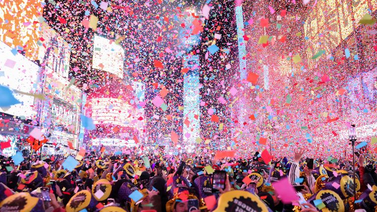 Bouquets fly around a ball and countdown timer during the first public New Year's Eve event since the coronavirus (COVID-19) pandemic, in Times Square, Manhattan borough of New City York, New York, USA, January 1, 2023. REUTERS/Andrew Kelly