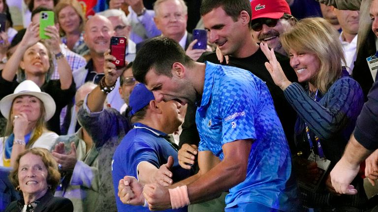 Novak Djokovic of Serbia celebrates in the stands with his support team after defeating Stefanos Tsitsipas of Greece in the men&#39;s singles final at the Australian Open tennis championship in Melbourne, Australia, Sunday, Jan. 29, 2023. (AP Photo/Aaron Favila)