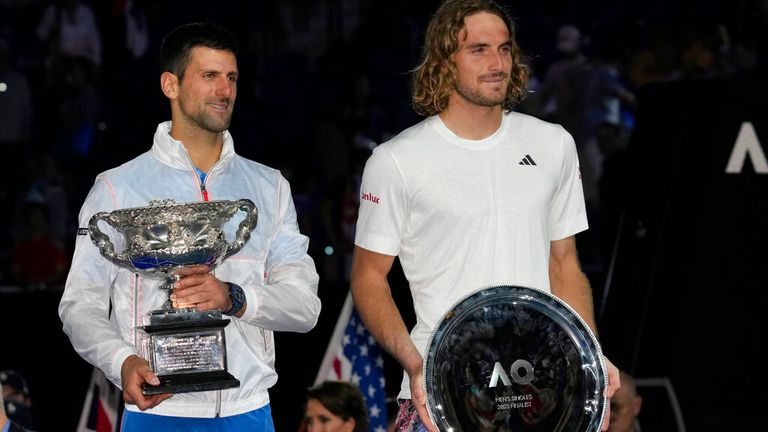 Novak Djokovic, left, of Serbia holds the Norman Brookes Challenge Cup, after defeating Stefanos Tsitsipas, right, of Greece in the men&#39;s singles final at the Australian Open tennis championship in Melbourne, Australia, Sunday, Jan. 29, 2023.(AP Photo/Dita Alangkara)
