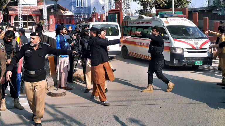 Ambulances transport wounded people from the bomb explosion site in Peshawar