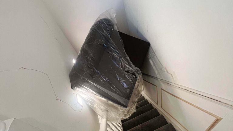 The sofa stuck on the stairs
Pic:SWNS
