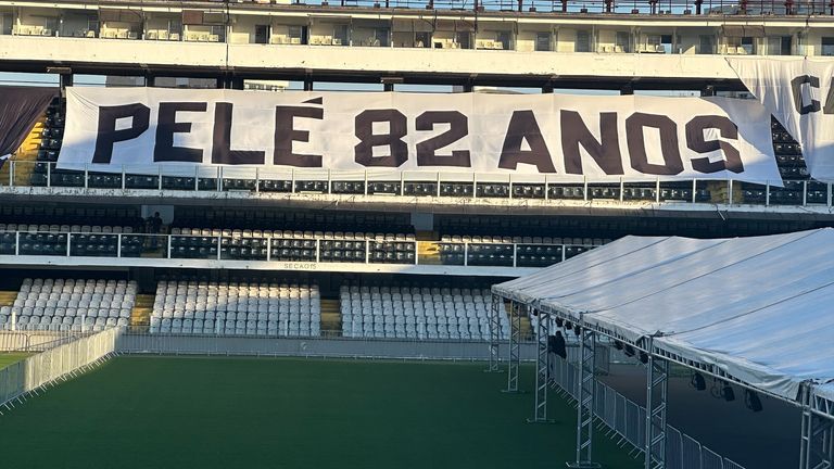 Jacquie Beltrao eyewitness at Santos FC where fans lined up to see the open coffin of Brazilian footballer Pelé