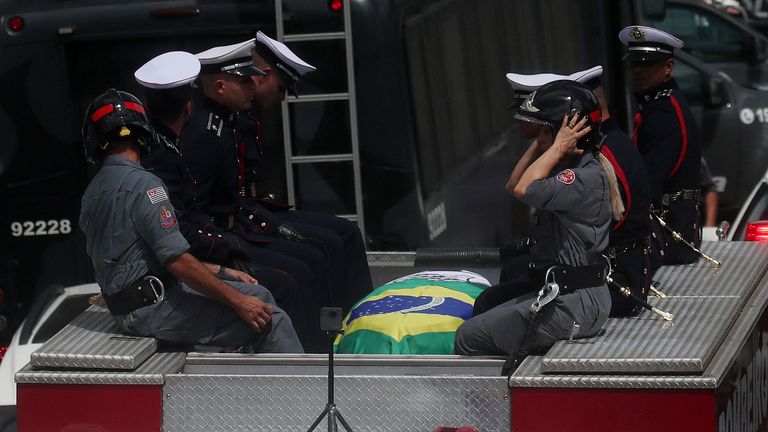 The casket of Brazilian soccer legend Pele is transported by the fire department, from his former club Santos' Vila Belmiro stadium 