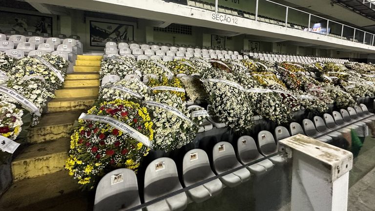 Jacquie Beltrao eyewitness at Santos FC where fans have queued to see the open casket of Brazilian footballer Pele
