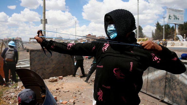 Demonstrators clash with security forces during a protest demanding early elections and the release of jailed former President Pedro Castillo, near the Juliaca airport, in Juliaca, Peru  