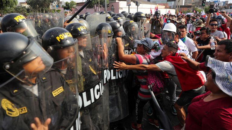 Rocks thrown as thousands of protesters march in Peru calling for president to step down