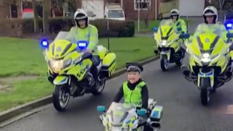 Durham police officers pay special visit to a little boy who lost his dad last year and who recently was given a mini police bike.