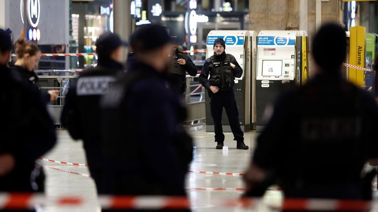 Police secure the area after a man with a knife wounded several people at the Gare du Nord train station in Paris