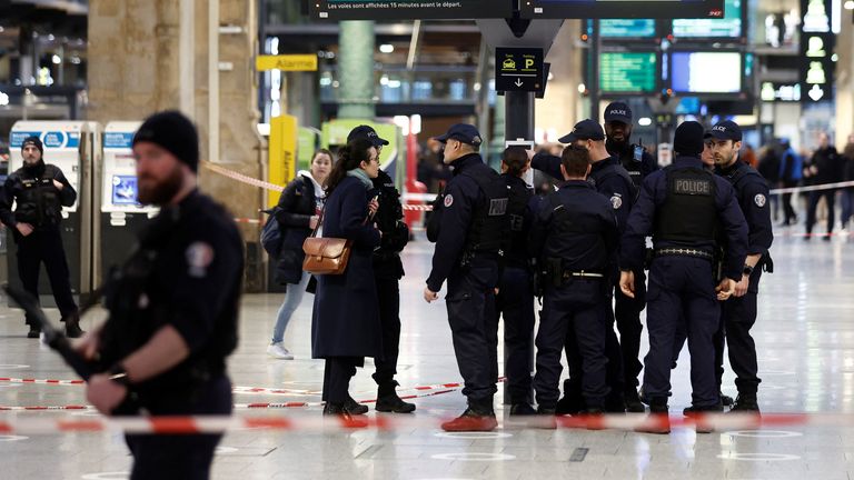 Police secure the area after a man with a knife wounded several people at the Gare du Nord train station in Paris 